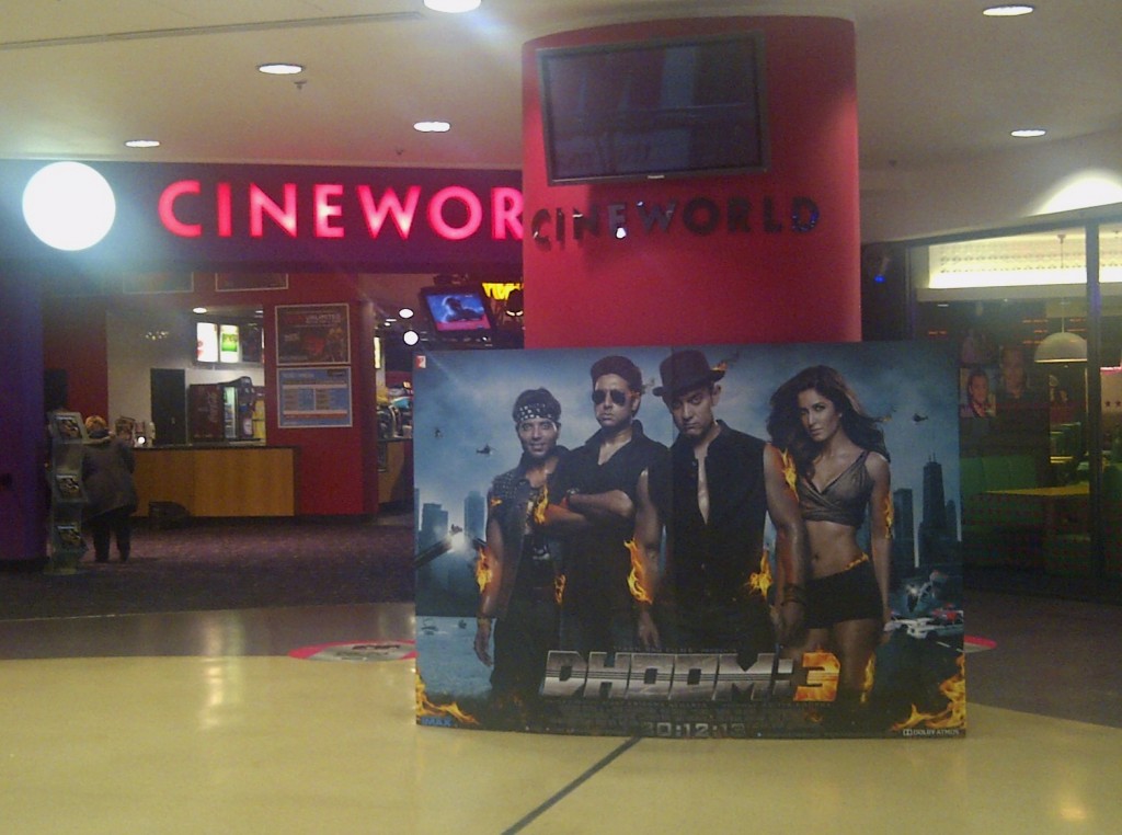 A huge poster the upcoming Bollywood action movie Dhoom 3 is exposed right in front of the Cineworld situated in Wood Green, London, UK