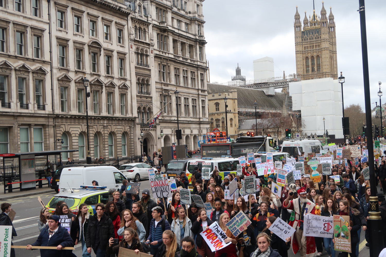 Young people marching on the streets of London for the climate