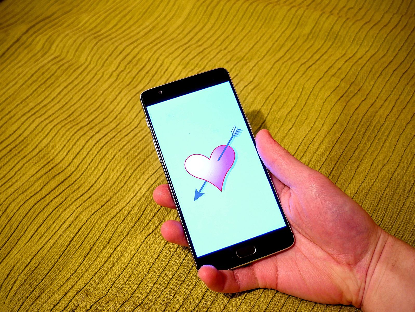 Smartphone with a picture of a heart on the phone screen